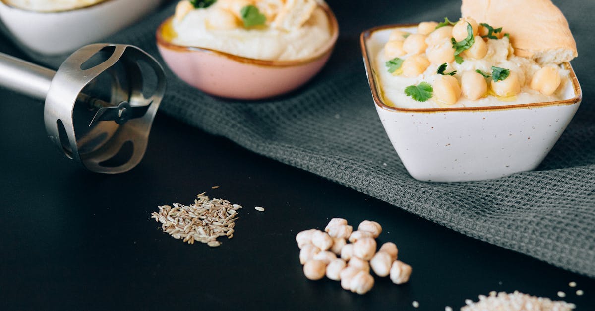 delicious creamy hummus garnished with chickpeas and herbs presented in a modern kitchen setting